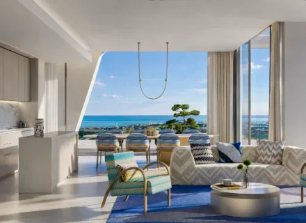 Stylish open-plan apartment with modern kitchen, designer furnishings and panoramic sea views from the terrace.