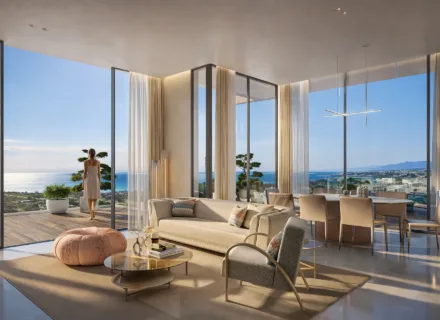 Elegant living room with floor-to-ceiling windows, modern furnishings and panoramic sea views from a spacious terrace.