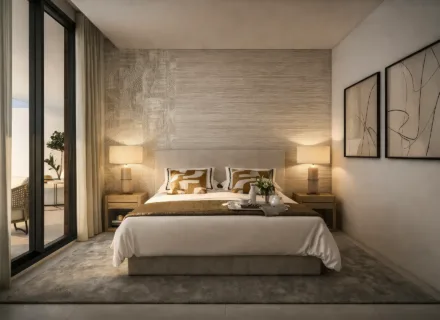 Elegant bedroom with double bed, bedside lamps, textured wall panels, neutral colors and large window with curtains.