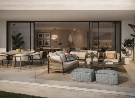 Elegant covered terrace with outdoor seating, dining table, glass balustrade, fireplace and seamless indoor-outdoor living.