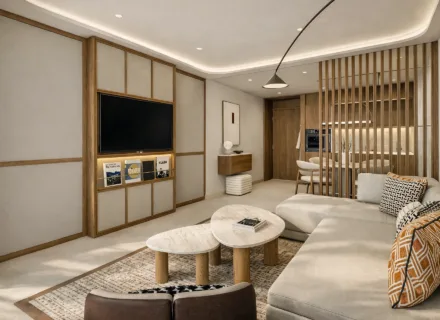 Azurean Marbella modern living room with open-plan layout, elegant furniture, warm wood details and luxury apartment design