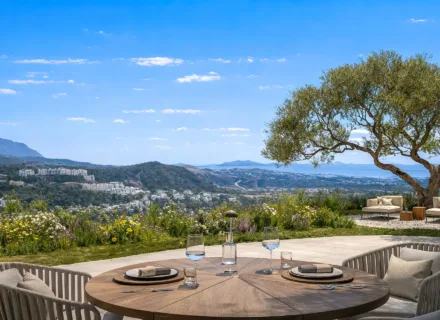 Azurean Marbella panoramic terrace with outdoor dining area, sea and mountain views, landscaped garden and luxury living