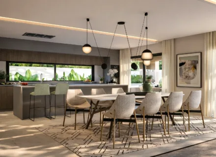 Modern kitchen and dining space with tropical views at One Bali Villas