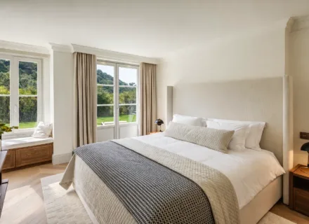 Elegant master bedroom at Villa Liora in Marbella with garden views, soft natural light, refined finishes and calm atmosphere