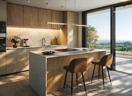 Designer kitchen at Apartments 360º by Cordia in Mijas, featuring premium appliances, elegant finishes and direct access to a terrace with sea views