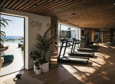 Private gym at Apartments 360º by Cordia in Mijas, featuring modern fitness equipment, elegant design and panoramic sea views for residents