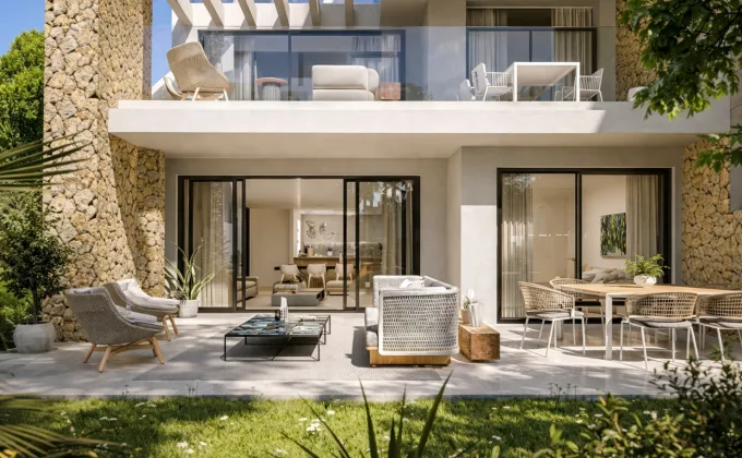 Elegant Ayana Estepona apartment with private terrace and garden, outdoor lounge area, modern design and natural materials.