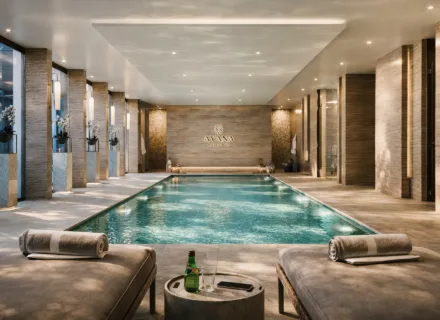 Luxury indoor spa pool at Ayana Estepona with elegant lighting, natural stone interiors and a serene wellness atmosphere.
