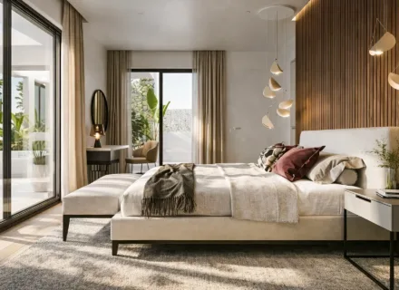 Luxury bedroom at Ayana Estepona with modern lighting, natural wood details, soft fabrics and access to a private terrace.