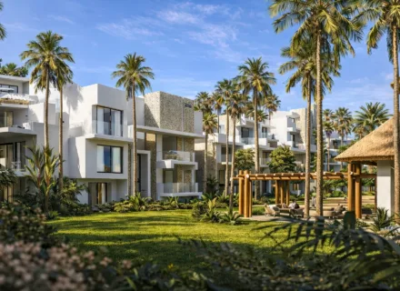 Modern Ayana Estepona apartments set in lush tropical gardens with palm trees, elegant architecture and peaceful resort living.