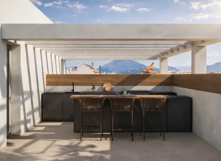 Luxury rooftop outdoor kitchen and bar terrace at Alcántara del Mar Mile residence